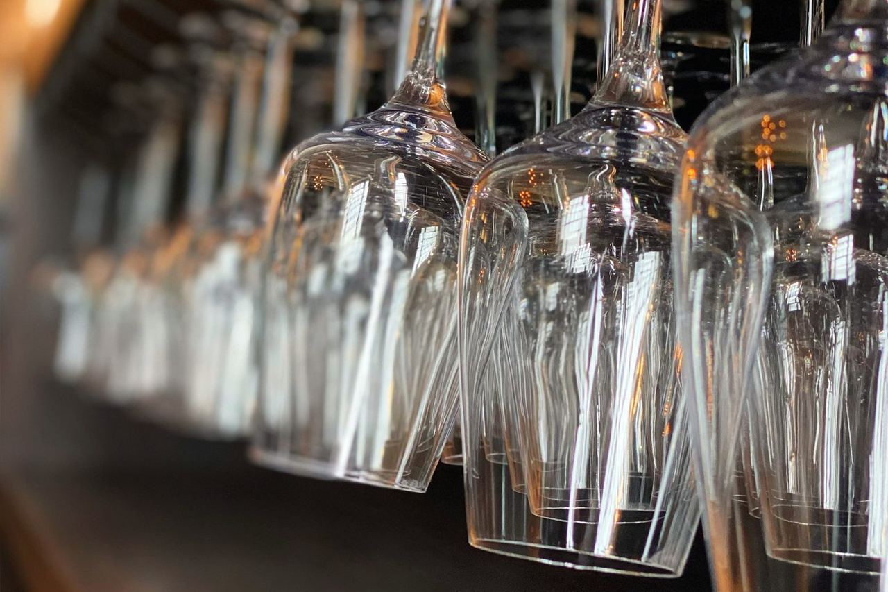 Glassware on the bar &middot; the Library is set for around twenty-five at a sitting